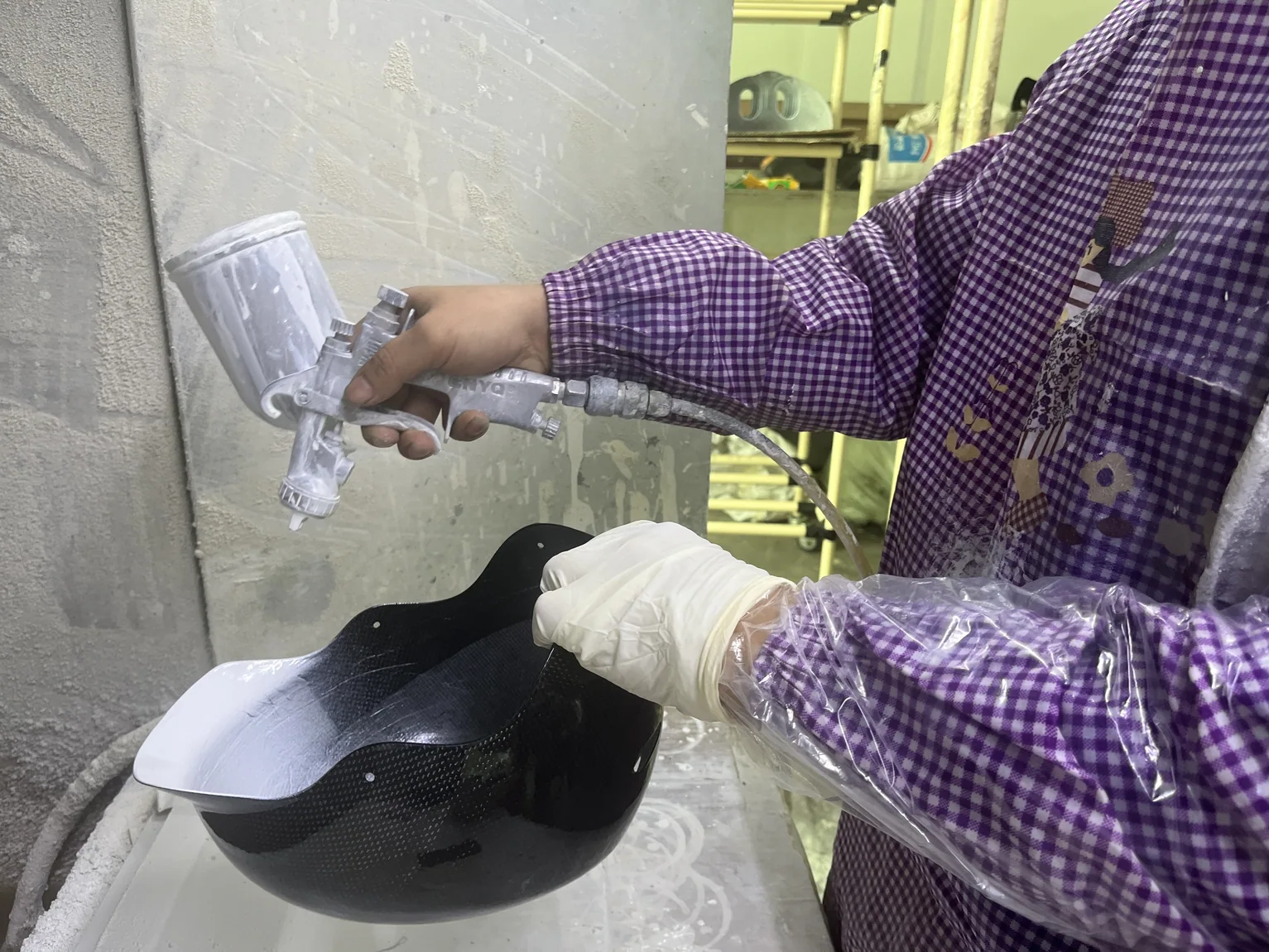 Composite component being manually finished by workshop worker