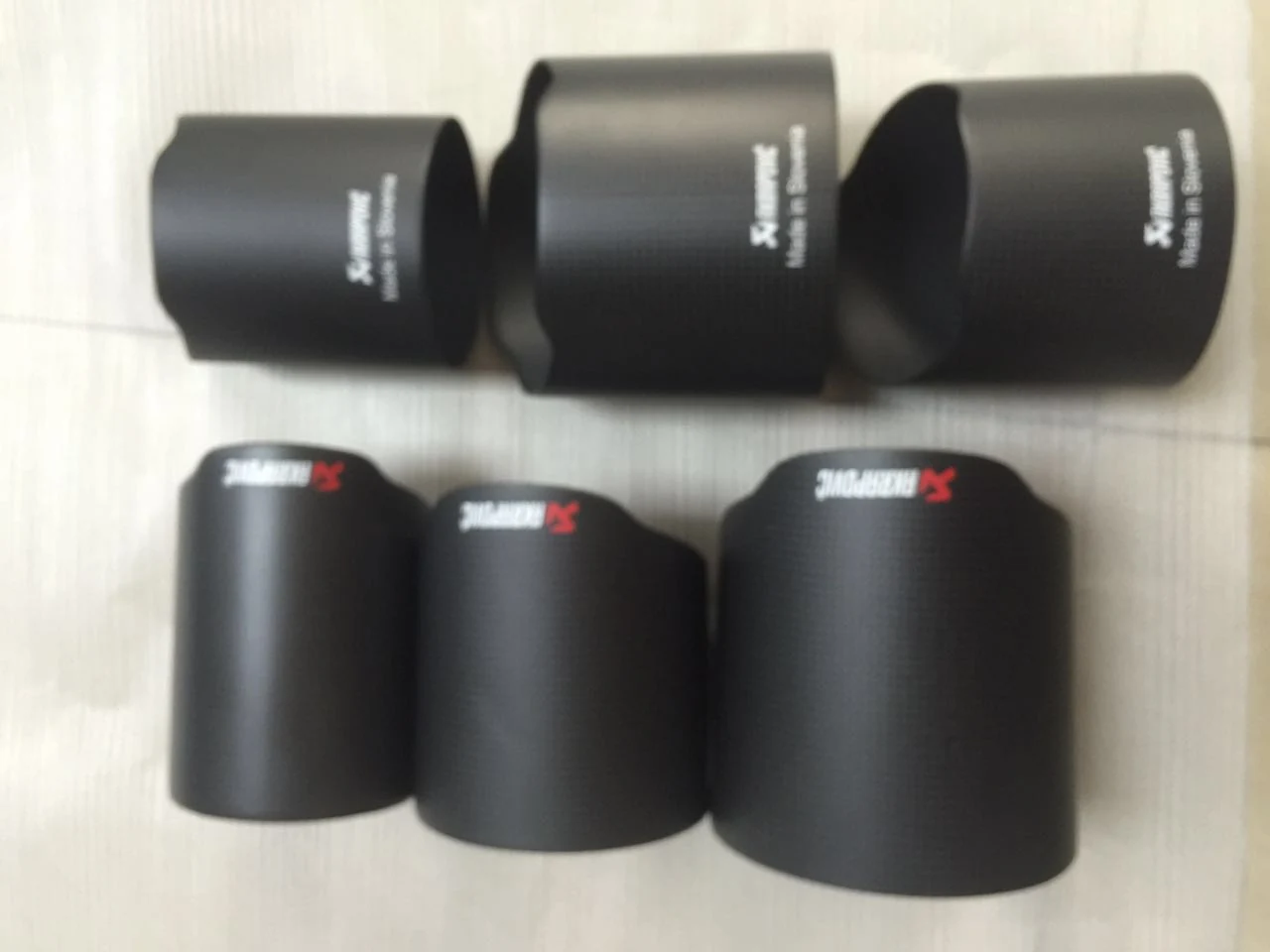 Black molded automotive carbon fiber components in multiple sizes, product case study