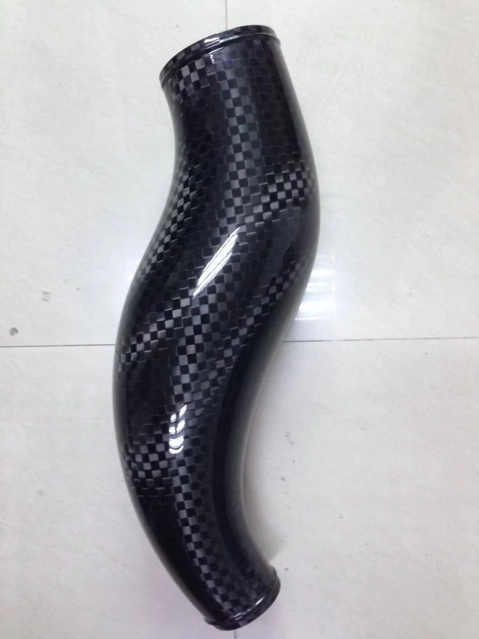 Curved carbon fiber tube with woven finish