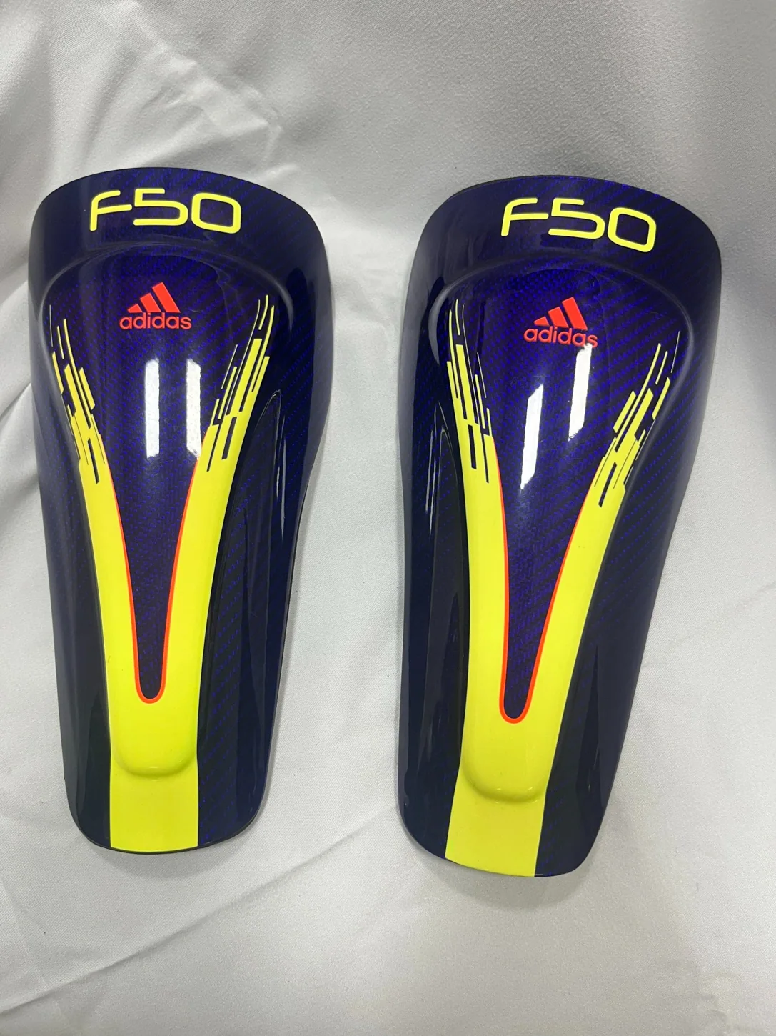 Colored carbon fiber protective sports components