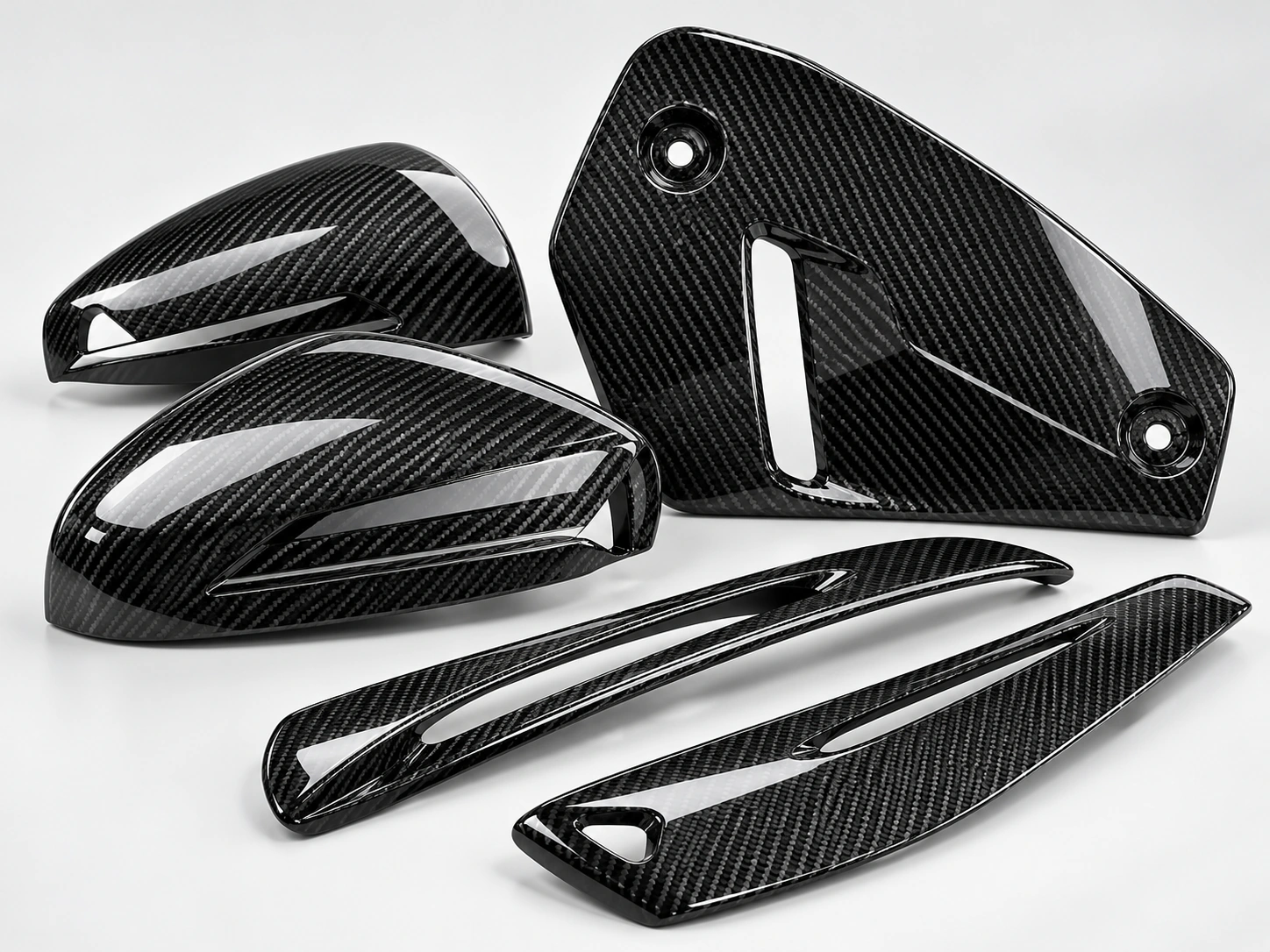 Illustrative studio image of carbon fiber automotive components