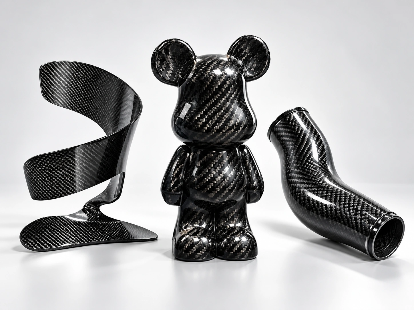 Illustrative studio image of custom carbon fiber decorative and formed parts